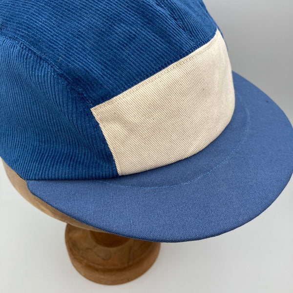 Blue cord panel cap in sizes XS-4XL